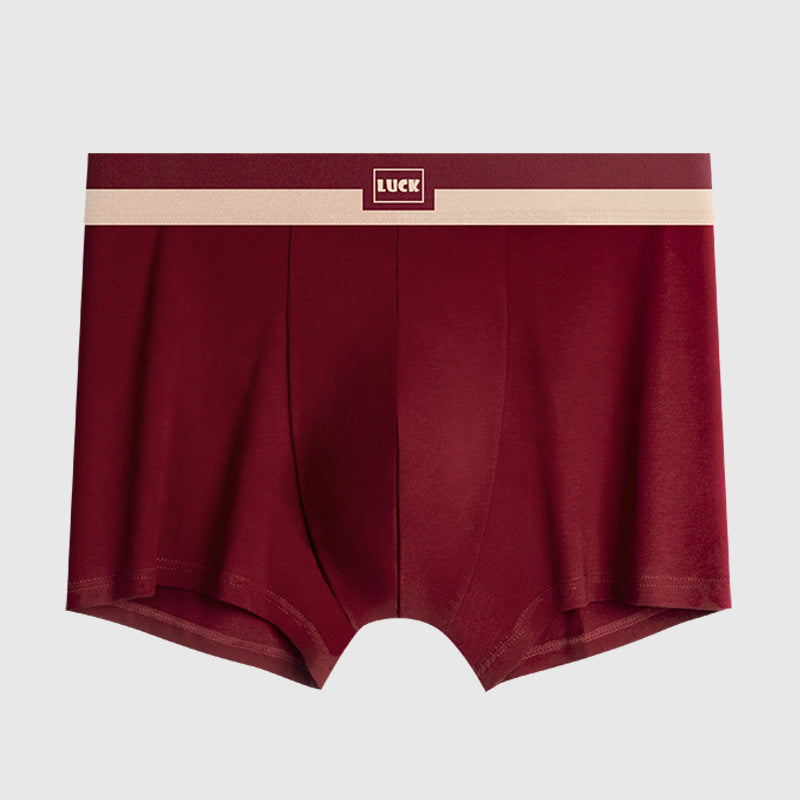 Burgundy men's boxer briefs with 'LUCK' logo and cream elastic waistband displayed against light gray background