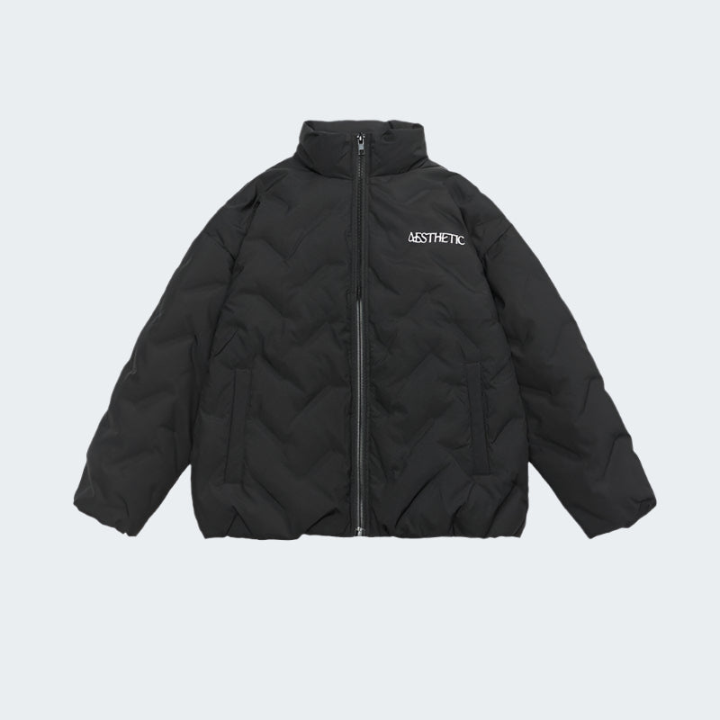 Black Aesthetic quilted puffer jacket with zip front closure and embroidered logo displayed flat against white background