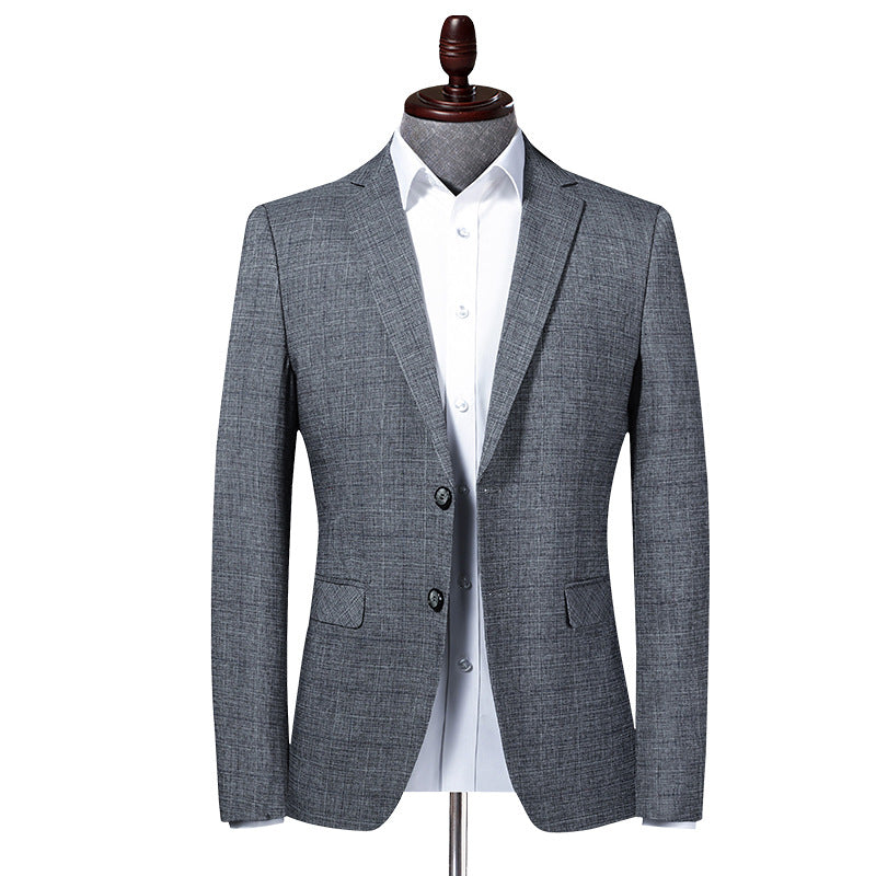 Gray textured blazer with white dress shirt on mannequin showing front view of slim-fit design and two-button closure