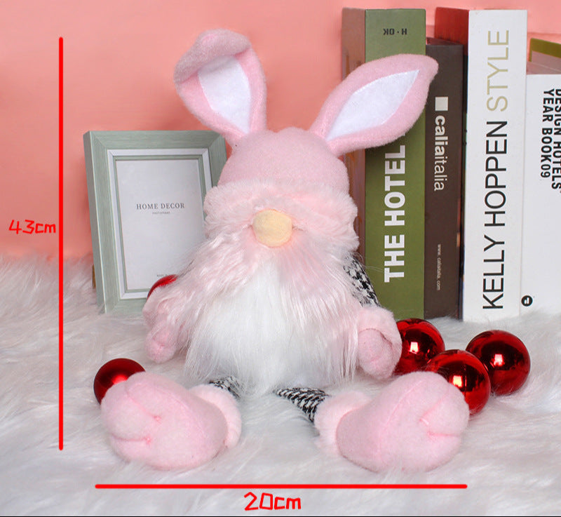 Pink Easter bunny gnome plush doll with long ears, a white beard, and black houndstooth legs, measuring 43cm in height and 20cm in width.