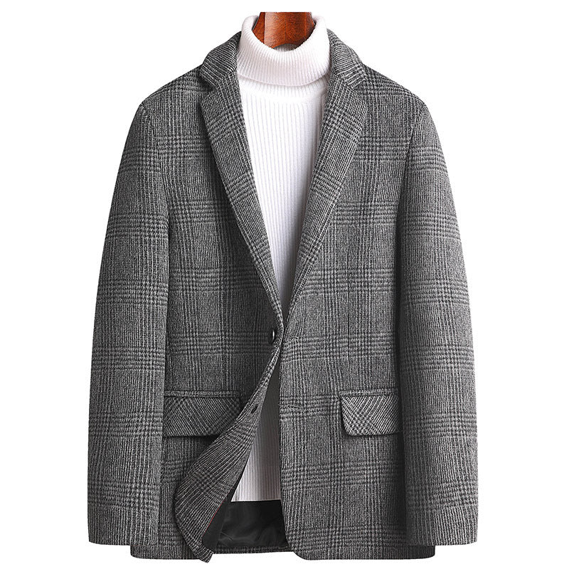 Front view of gray glen plaid blazer styled with white turtleneck. Single button design with notched lapels and structured shoulders for business-casual wear