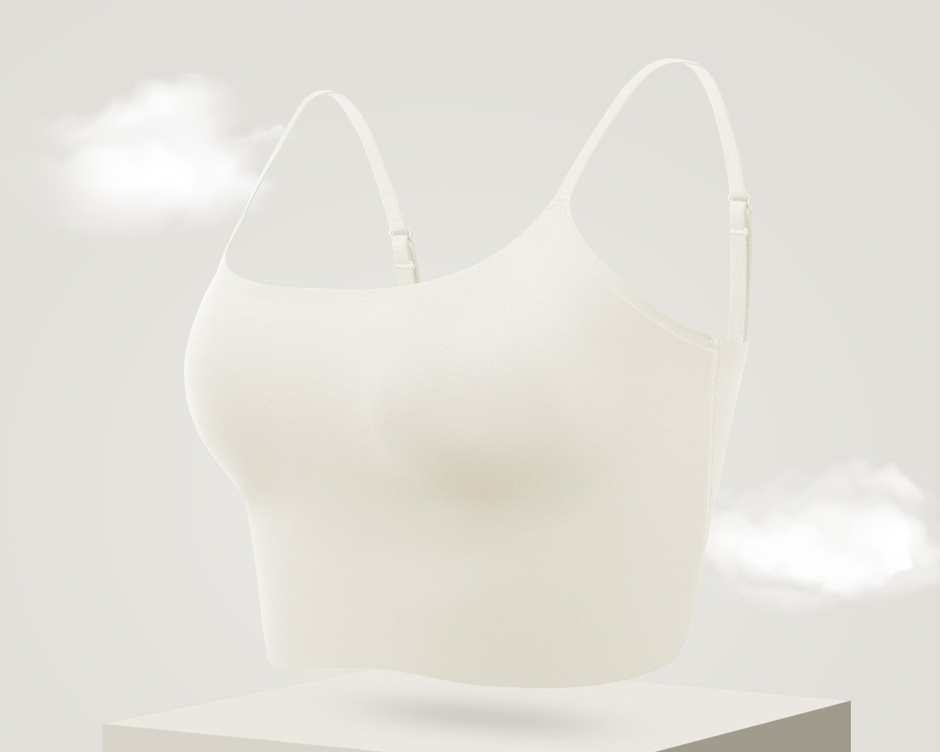 Soft white seamless bra with adjustable thin straps, providing a smooth and comfortable fit.