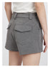 Close-up of back pocket details on gray tailored shorts with premium stitching