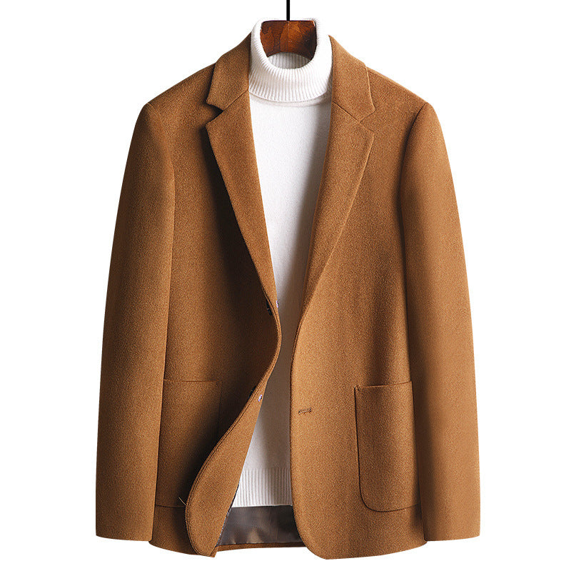 The camel blazer displayed with a white turtleneck underneath, slightly open to show the styling