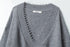 Deep V-neck detail with ribbed trim and Airhood brand label, showing intricate stitch pattern at collar.