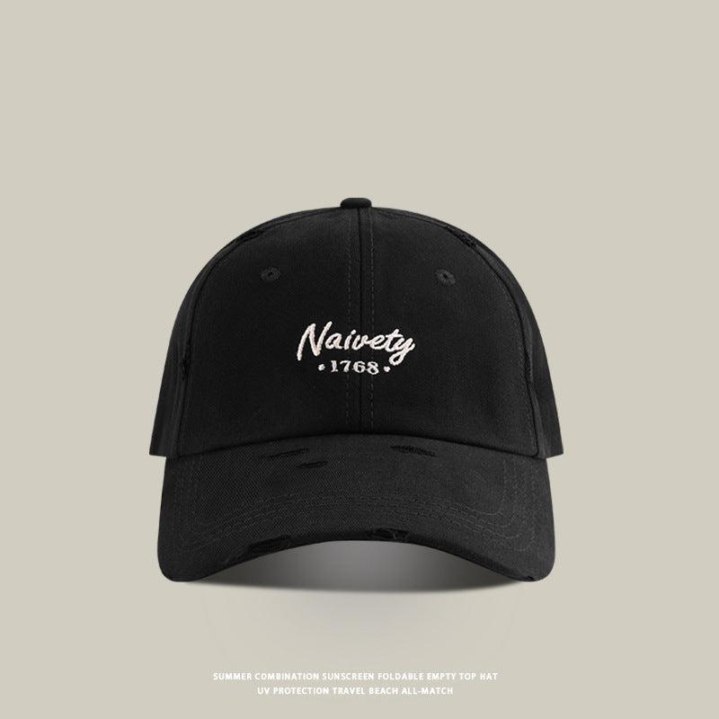 Black baseball cap with white 'Naivety 1768' embroidered logo