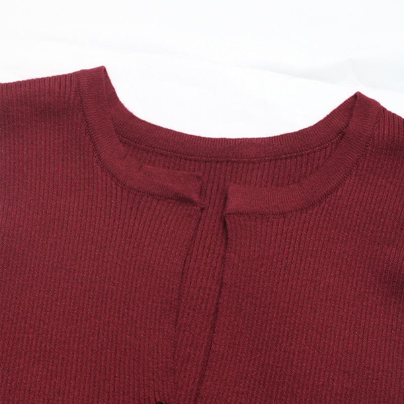 Close-up of the round neckline and ribbed texture of the burgundy sleeveless top.