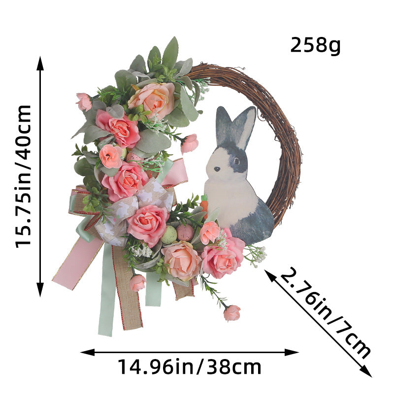 A detailed size reference image of a 15.75-inch Easter wreath with faux roses, greenery, and a bunny figure.
