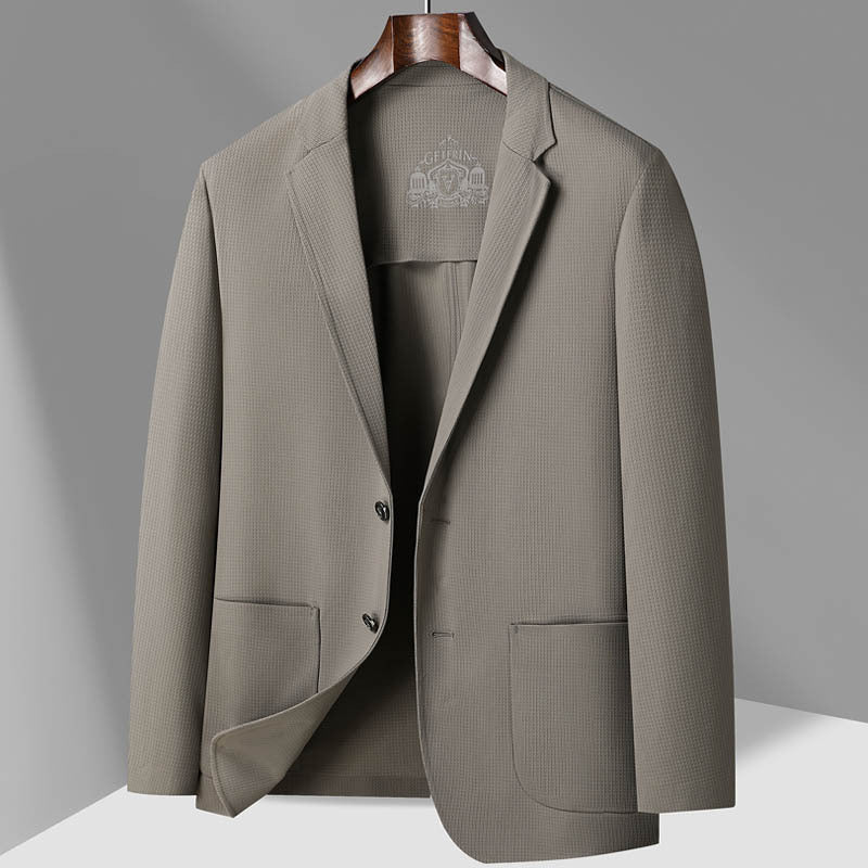 Light beige textured GFJFRIN blazer on wooden hanger, showing two-button design and casual silhouette against gray background