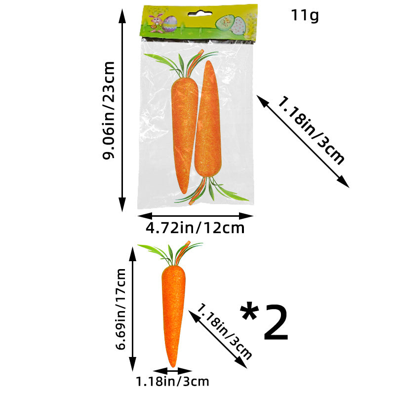 A package of two large artificial carrots with green leaves, displayed with measurements for size reference.