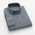 Navy and green plaid flannel shirt with button-down collar and matching green buttons