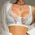 White lace-detailed bralette with front hook closure, shown with sheer white top and gold chain necklace