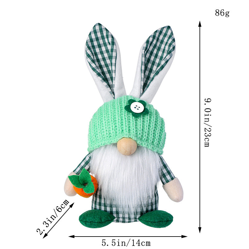 Green bunny gnome plush with gingham ears and a knit hat, measured at 23cm height.

