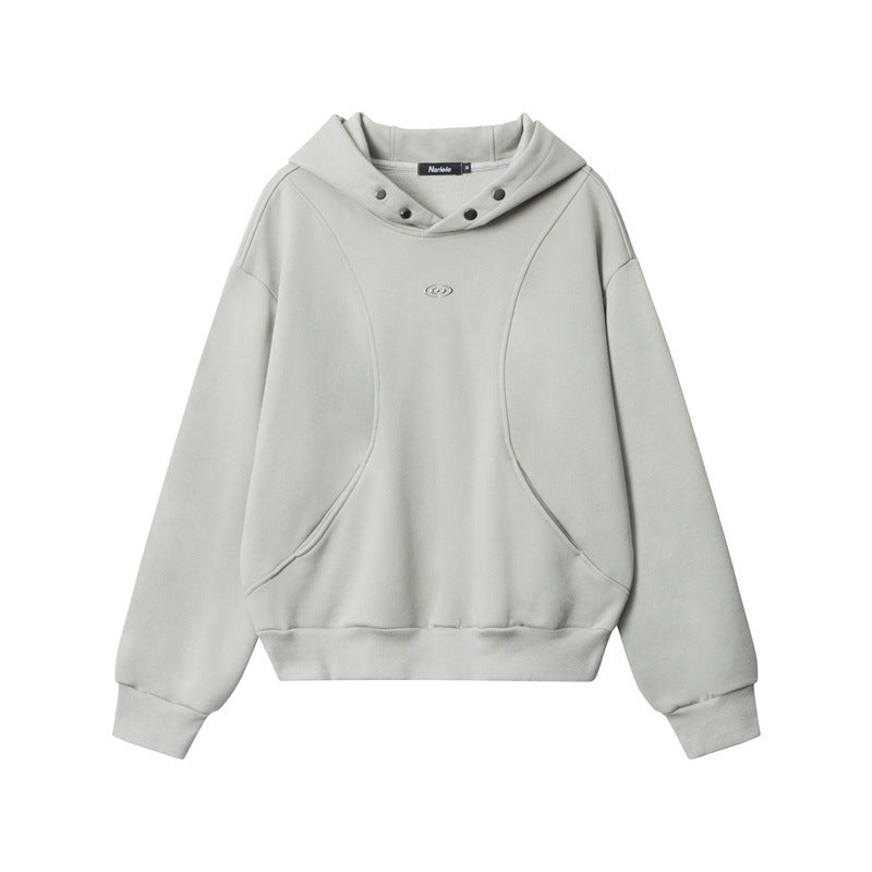 Light gray hooded sweatshirt with curved seam design, snap-button hood detail, embroidered eye logo on chest, and ribbed cuffs