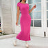 Front view of hot pink fitted maxi dress with cap sleeves and slit, worn with platform sneakers and socks