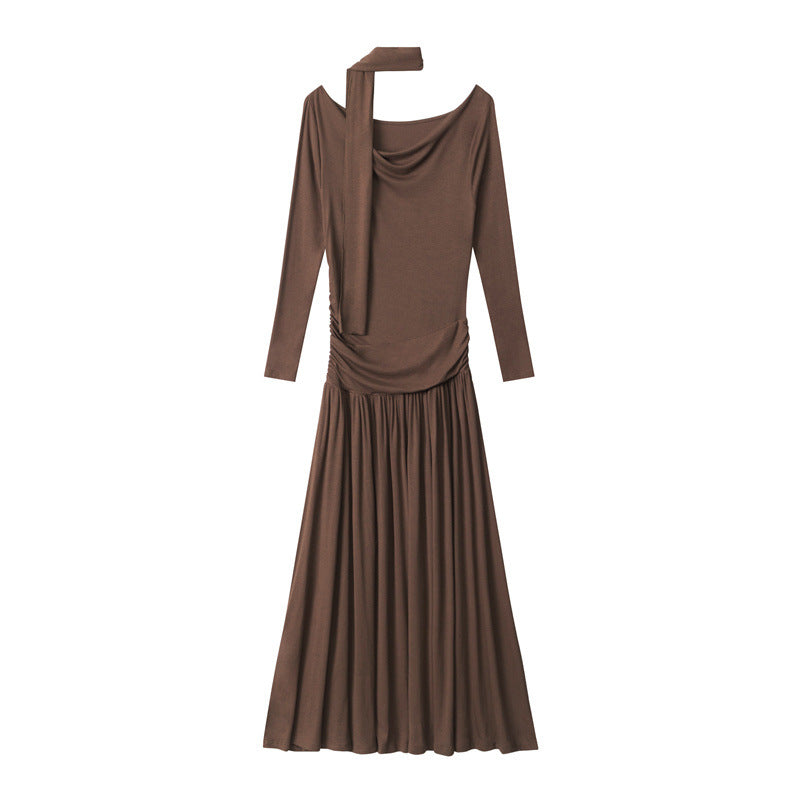 Brown maxi dress product shot highlighting draped neckline, ruched bodice construction, and full-length flowing skirt design