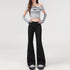 Front view, full-body shot of black flare trousers styled for casual streetwear.