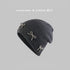 Dark gray beanie with "Peipi Hat Industry" text, featuring pearl-studded bow decorations