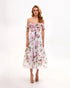 Romantic pink floral organza midi dress with off-shoulder design and delicate bow details, styled for special occasions