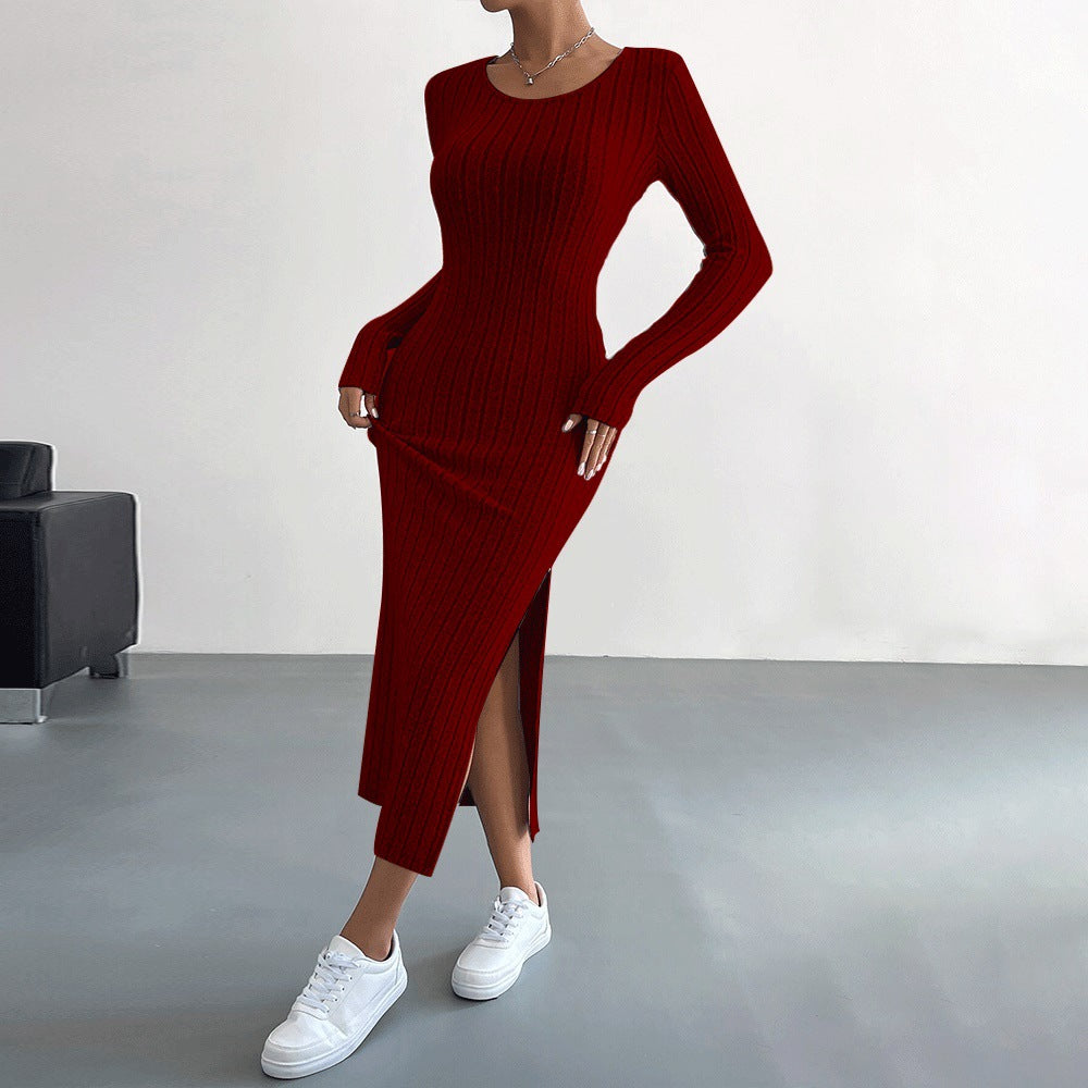 Deep red ribbed long-sleeve midi dress with high side slit, styled with white sneakers for versatile look