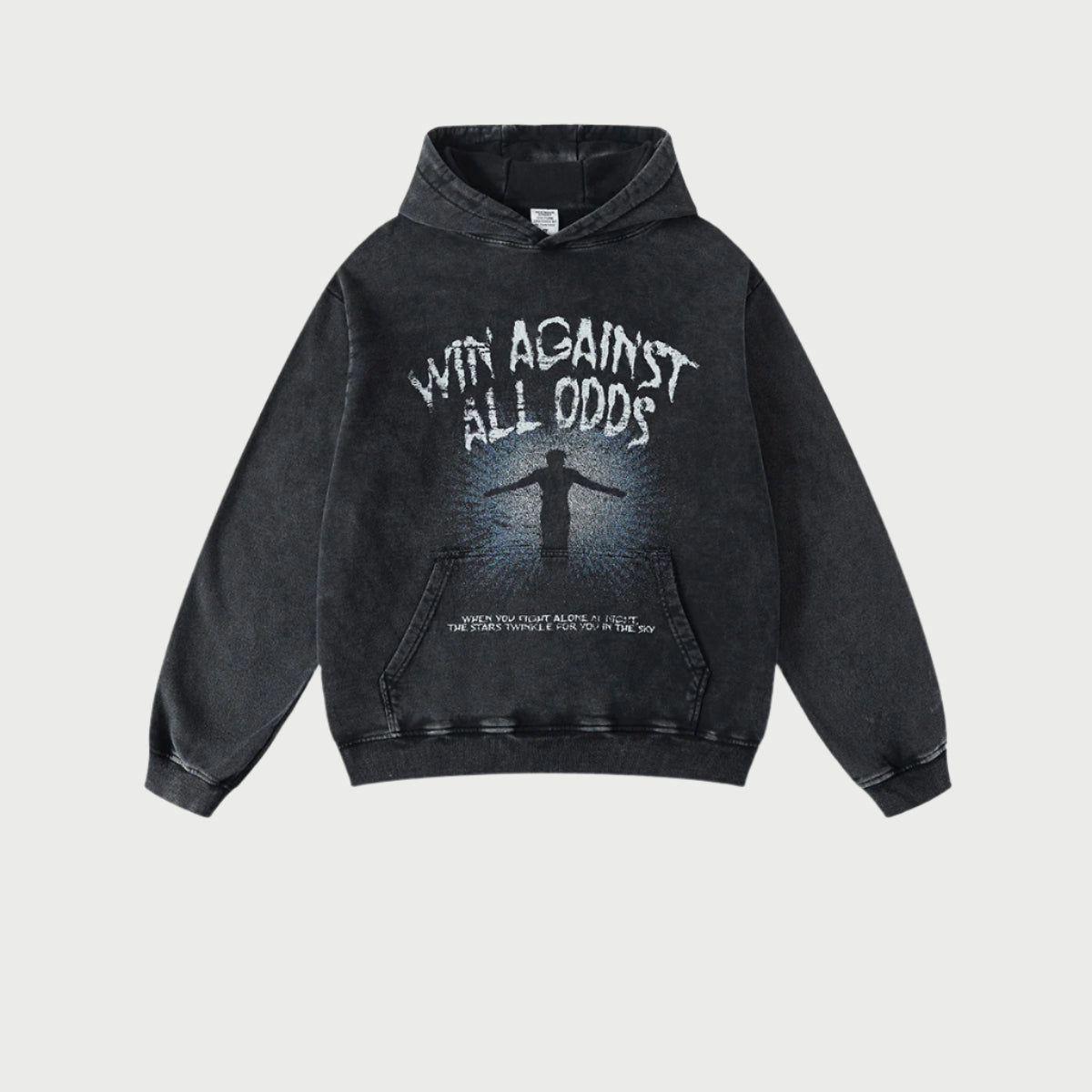 Flat lay of black "Win Against All Odds" graphic hoodie on white background