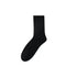 Black sock with soft, fuzzy texture, displayed against a white background