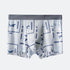 Front view of men's boxer briefs with gray waistband and white base featuring repeating blue vintage game motifs