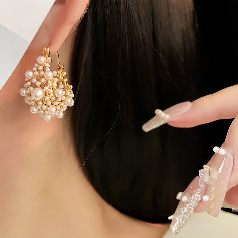 Elegant pearl cluster earrings with gold metalwork