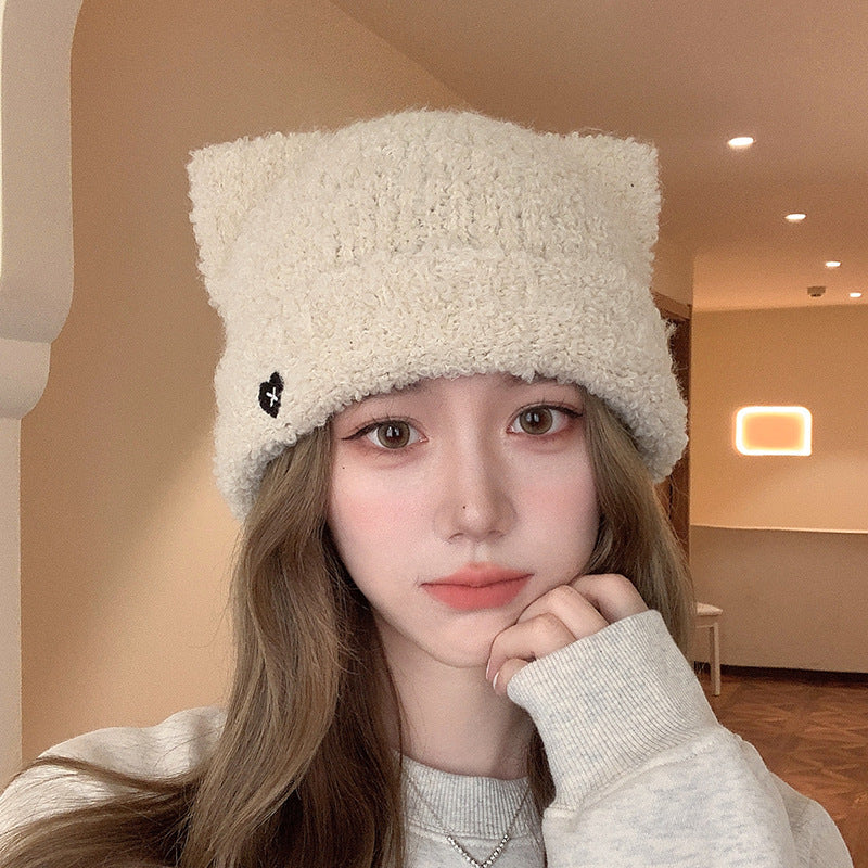 White Cat Ear Beanie Hat on Model – Fluffy white beanie hat with cat ears, a trendy and cozy accessory for cold weather
