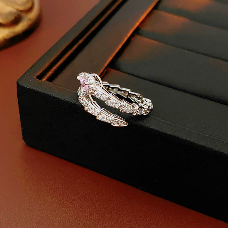 Luxury snake ring in black jewelry box with detailed diamond setting