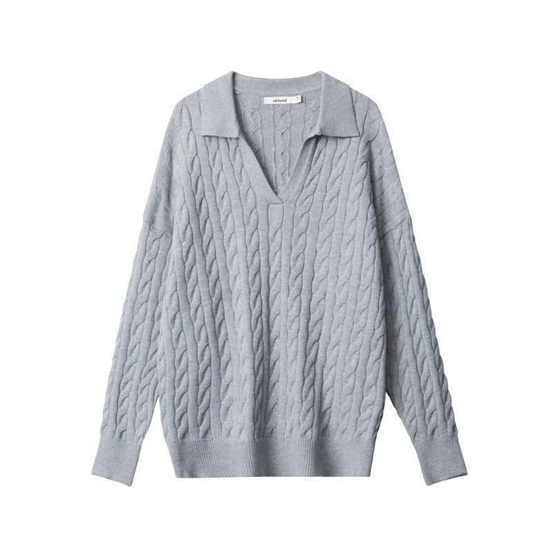 Grey V-neck polo sweater with all-over cable knit pattern and ribbed trim.
