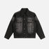 A black washed denim jacket with an ombre fade effect laid flat, highlighting its structured design
