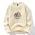Cream knit sweater with brown mountain logo graphic