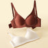  Two wireless push-up bras in burgundy and white, featuring smooth support and molded cups.