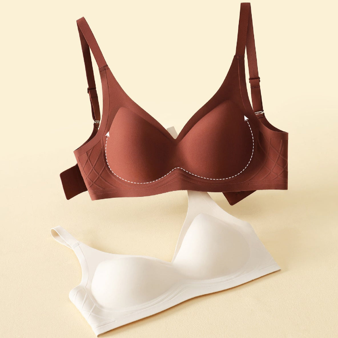  Two wireless push-up bras in burgundy and white, featuring smooth support and molded cups.