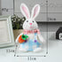 White plush bunny in blue checkered overalls, holding a fabric carrot, with size dimensions labeled at 24cm height and 11cm width.