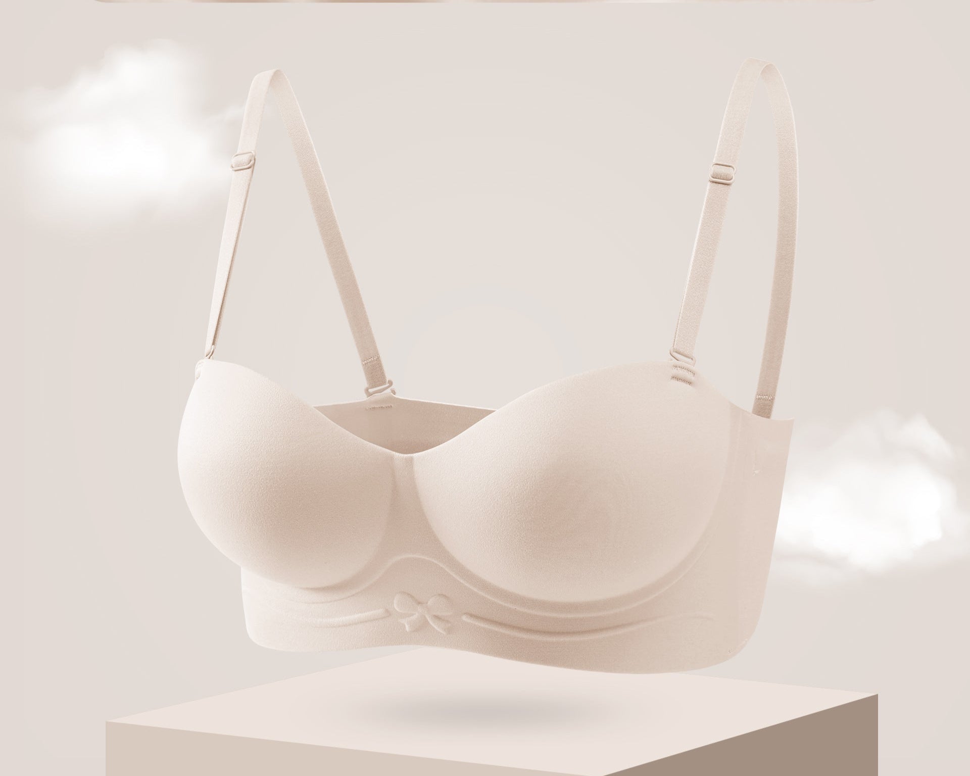 Rose pink strapless bra with molded cups and a bow detail on the band.