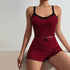 Two-piece burgundy sleep set in ribbed fabric with black lace trim, contrasting bow details and scalloped edges
