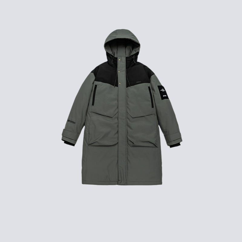 Product shot of gray/black technical parka with hood up displaying front pockets and sleeve patch against light gray background