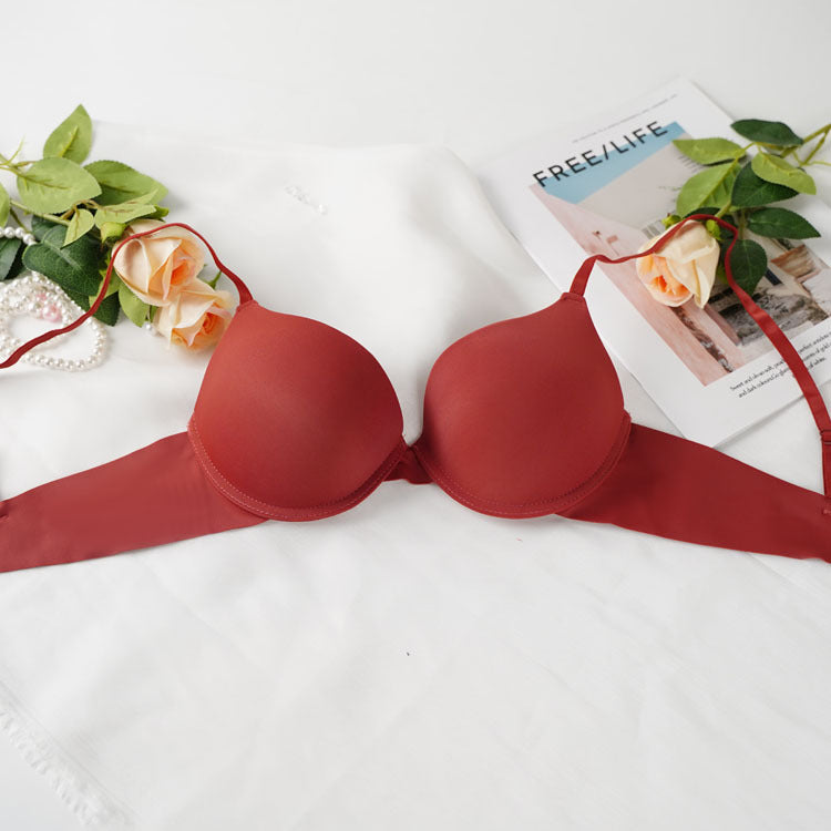 Terracotta red push-up bra with roses and pearls showcasing comfortable design