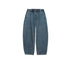 Product shot of balloon-fit medium-wash denim jeans with three-button waistband, wide legs and vertical seam detail on white background