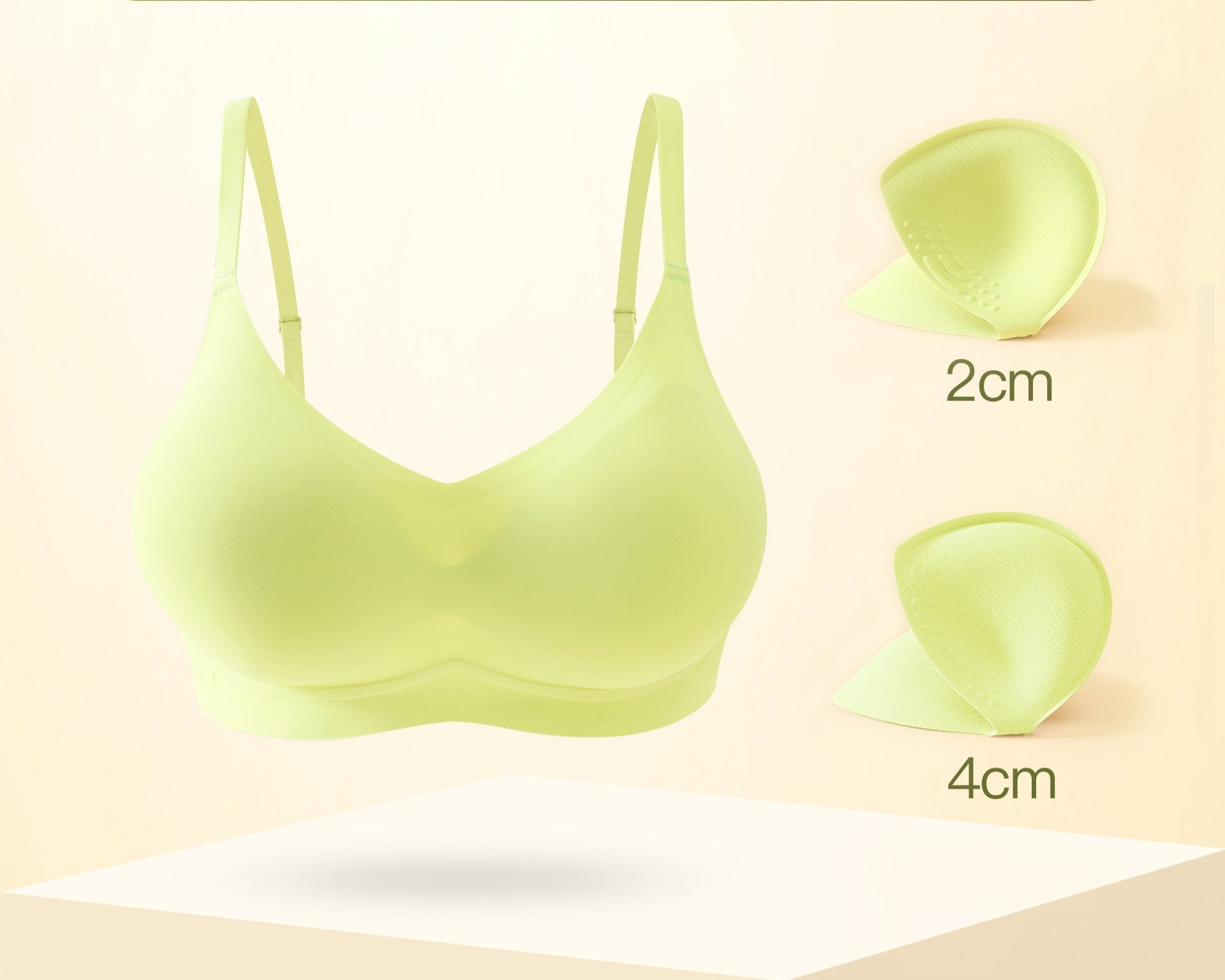 green seamless bra with removable padding for customizable lift.