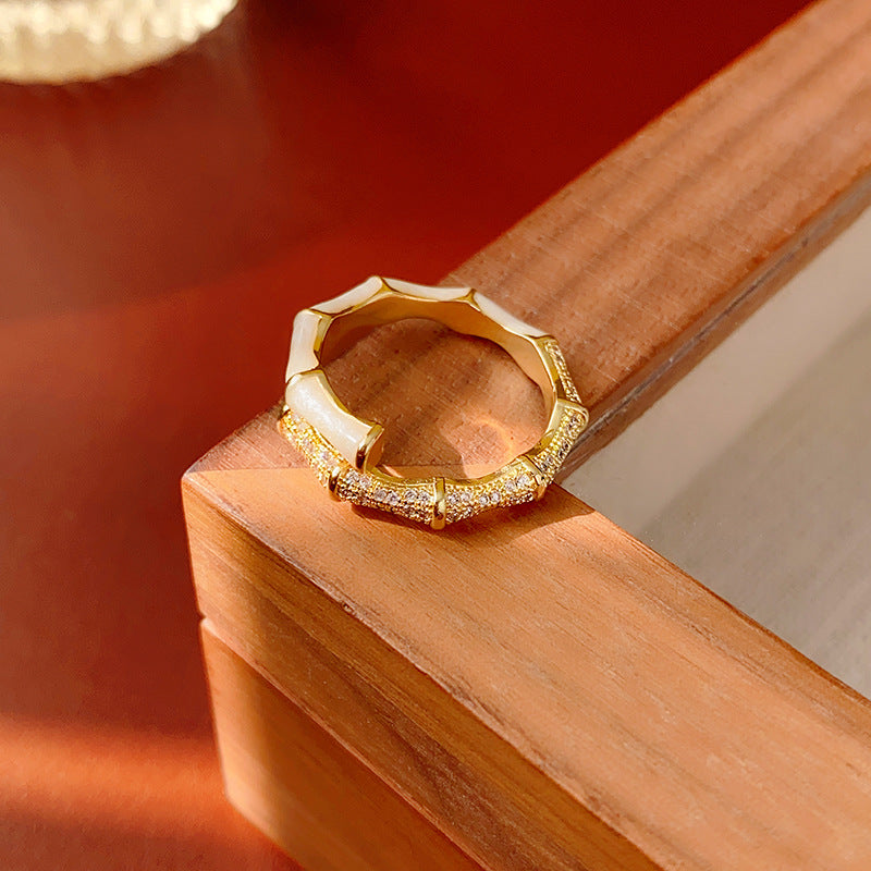 Close-up of gold bamboo ring with crystal detailing