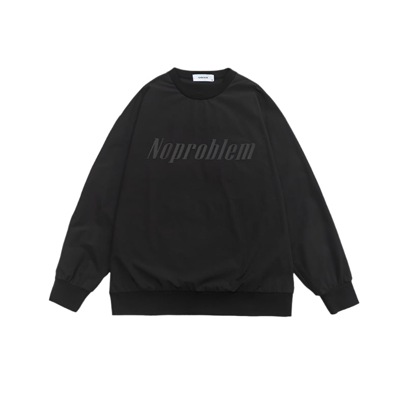 Black oversized sweatshirt with ribbed cuffs and tonal embossed "Noproblem" text, offering a sleek monochrome look