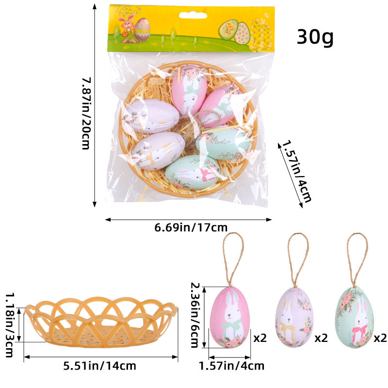 Packaged Easter egg set with six pastel hanging eggs and a woven basket, featuring bunny and floral prints with labeled dimensions.