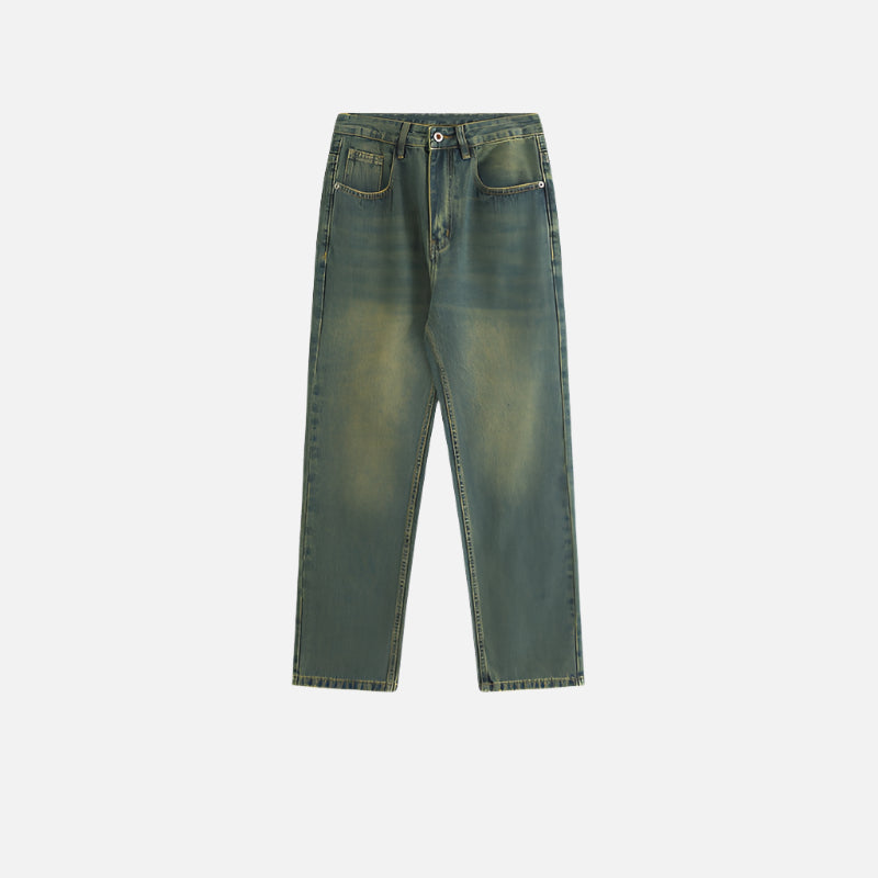 A flat-lay of a pair of vintage-washed loose-fit denim jeans with a worn look, laid against a white background