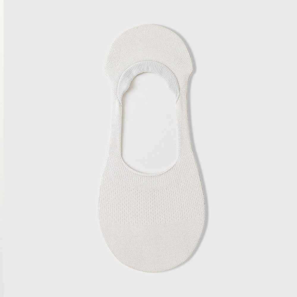 White knit no-show sock liner with mesh pattern and elastic band, photographed flat on light gray background