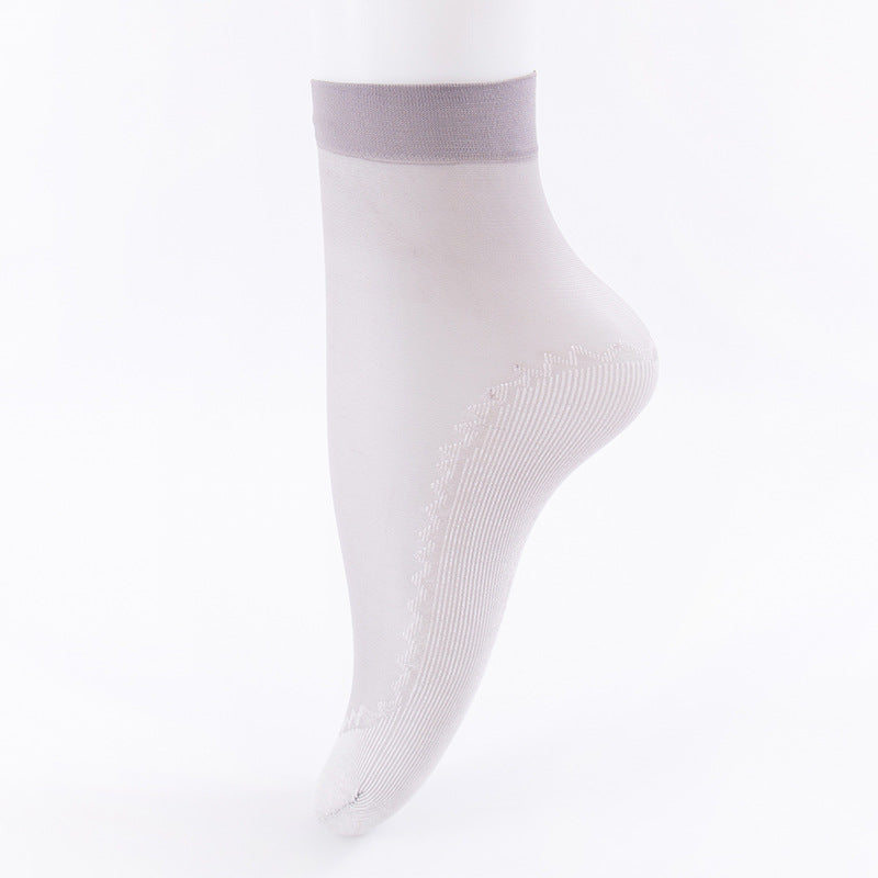 White sheer ankle sock with grey band and ribbed sole pattern on white background