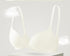 Cream seamless push-up bra with a front clasp and adjustable straps for a smooth, flattering fit.