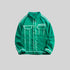Green SANHOMME outline denim jacket displayed against gray background, featuring white contrast stitching and chest pockets
